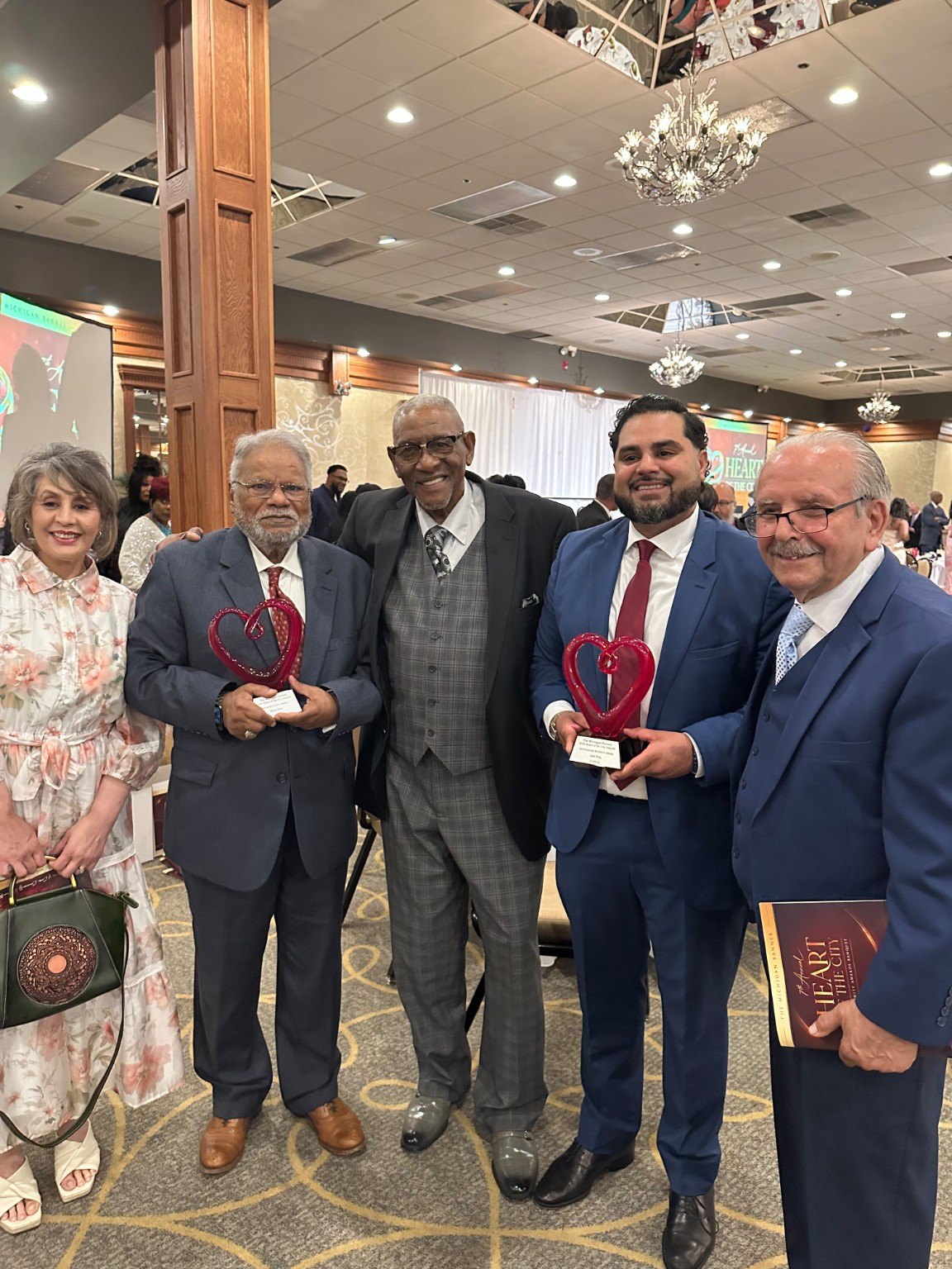 Award recipients and community leaders at a recognition event